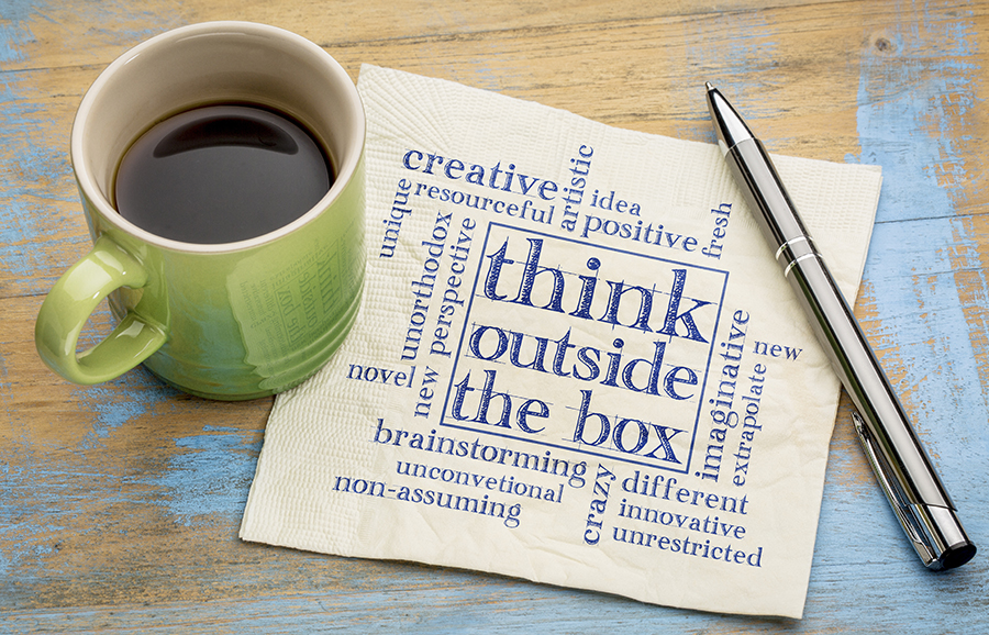 Think Outside The Box Concept - Word Cloud On A Napkin With A Cup Of Coffee