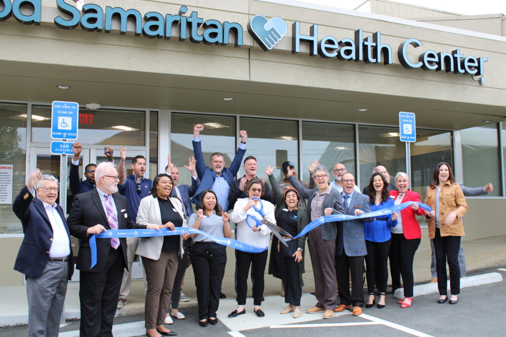 Staff and supporters celebrate ribbon-cutting