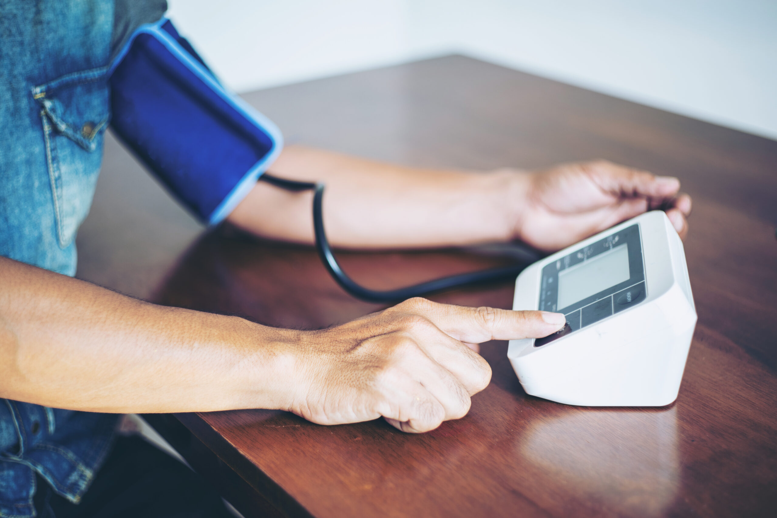 Man Is Taking Care For Health With Hearth Beat Monitor And Blood Pressure Selective Focus.