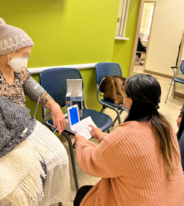 Patient receiving a blood pressure machine