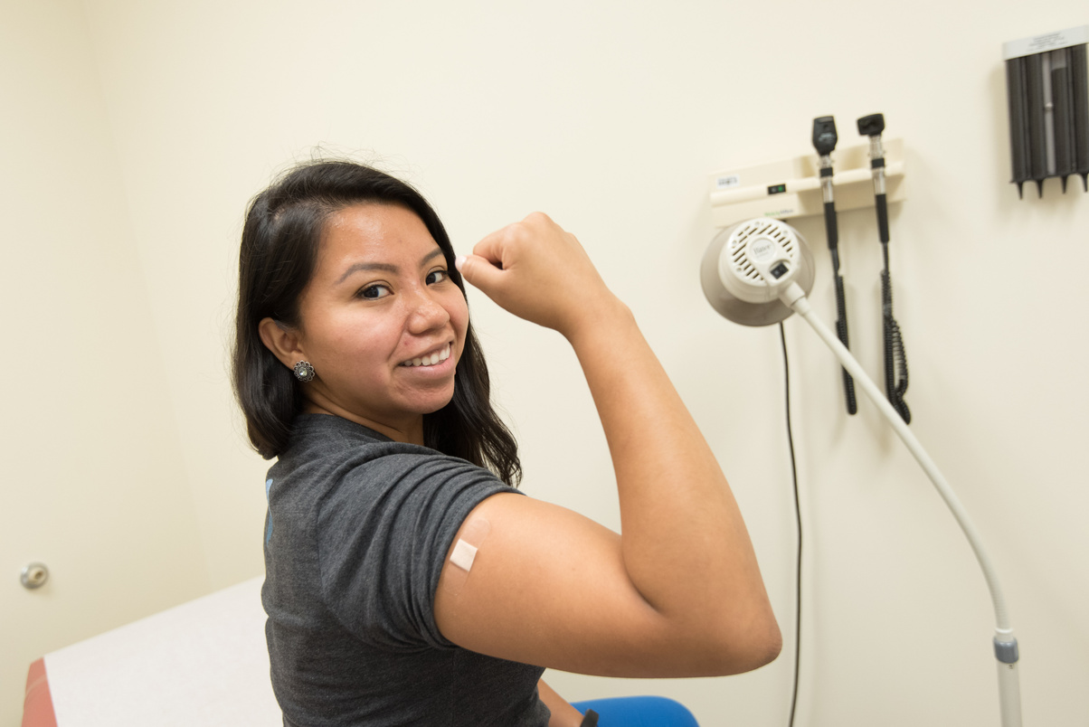 Patient Flexing Muscle After Shot